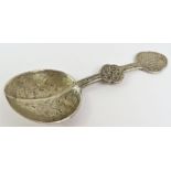 A medicine spoon, with typical decoration, testing