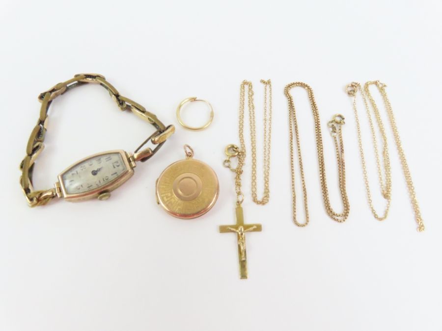 A 9ct gold crucifix, a 9ct gold box link chain, a