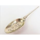 An unmarked silver mote spoon,