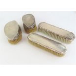 A pair of oval silver backed clothes brushes toget