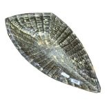 A large leaf shaped pottery dish with slip glaze d