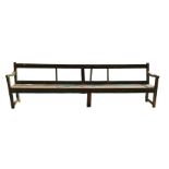 A long painted wood bench seat 302cms long