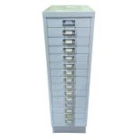 A painted metal cabinet of 15 narrow drawers, 98cm
