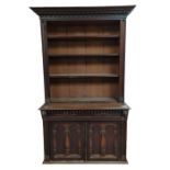 A 19th century carved oak bookcase the upper secti