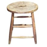 A four legged stool with pierced elm seat, 51cm h