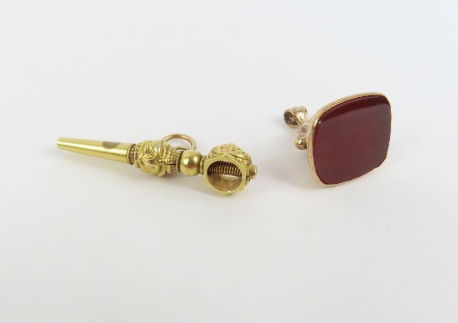 A fob set with a dark red hardstone, 1.8cm high