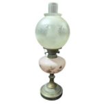 A late 19th/early 20th century oil lamp having flo