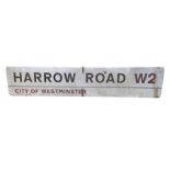 A rectangular enamelled metal sign "Harrow Road W2