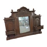 A 19th Century cast iron overmantel with mirror an