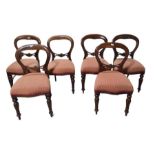 A set of six mahogany balloon back dining chairs w