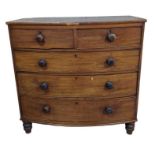 An early 19th century mahogany bow front chest of