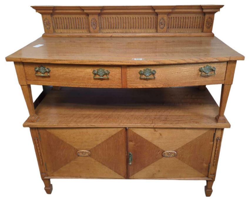 A 20th century oak sideboard with two short drawer