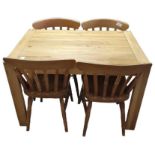 A modern heavy light oak dining table with extensi