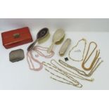 A collection of costume jewellery in a leather case,