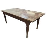 An Asian hardwood dining table raised on four carv