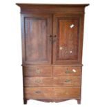 A George III oak housekeepers cupboard, the pair o