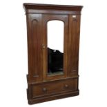 A Victorian mahogany wardrobe with mirrored door a