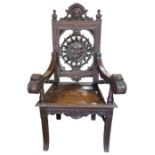 An imposing Victorian oak wainscot chair the back