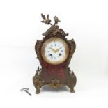 A French mantel clock striking on a bell having ci