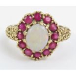 A 9ct gold opal and ruby cluster ring, the oval op