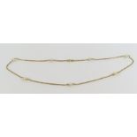 An oval link necklace, with seven cultured pearls