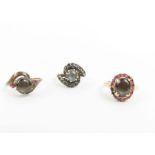 A black star sapphire and ruby ring; a black star