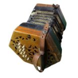 A concertina labelled Lachenal and having 10 keys
