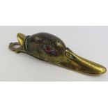 A Victorian brass stationery clip in the form of a