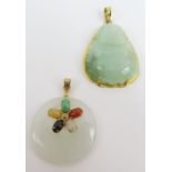 A round white jadeite pendant, set to the top with