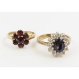 A 9ct gold garnet cluster ring, finger size K 1/2;