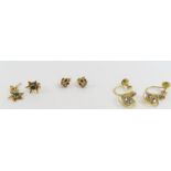 A pair of 9ct gold green stone set star shaped stu