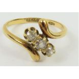 An early 20th century 18ct gold three stone diamon