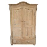 A Victorian stripped pine wardrobe with drawer in