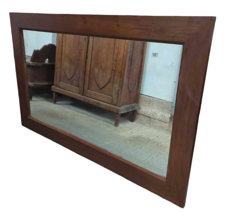 A large rectangular hardwood framed wall mirror ov