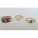 A single stone ruby ring, marked '750', finger siz