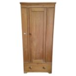 A pine single wardrobe with drawer to base, 180cms