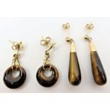 A pair of tear drop tiger's eye earrings; together