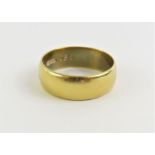 A wide 18ct gold wedding band, 7mm wide, T centre,