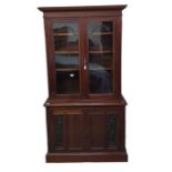 A late Victorian mahogany bookcase the top with pa