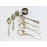 A collection of sterling silver spoons, along with