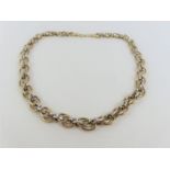 A 9ct yellow and white gold mixed link chain, 44.5