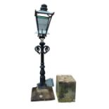 A black painted metal electric garden light in the