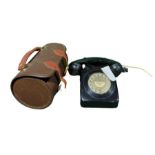 A black telephone 746F DFM69/1 together with two b