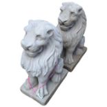 A pair of cast concrete lion garden ornaments, 54c