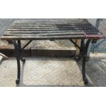 A rectangular garden table on wrought iron base, 1