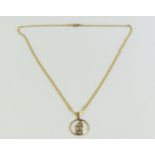 A 9ct gold open work St Christopher pendant on a 9