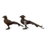 A pair of metal pheasant ornaments, 16cms high