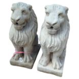 A pair of cast concrete lion garden ornaments, 54c