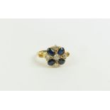 An 18ct gold unusual sapphire and diamond cluster
