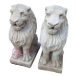 A pair of cast concrete lion garden ornaments, 54c